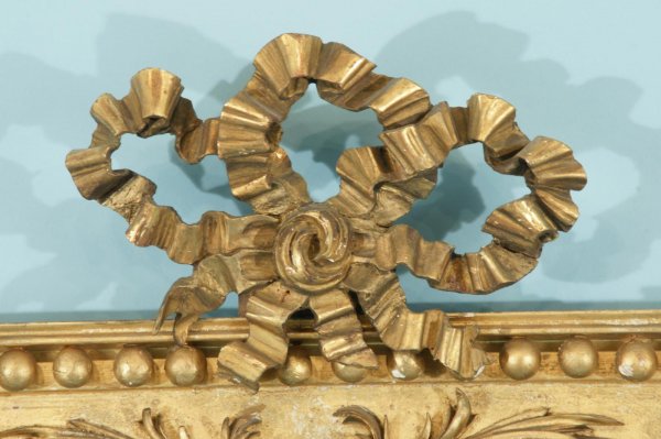 A HIGHLY CARVED AND GILTWOOD MIRROR, CIRCA 1830 - 5