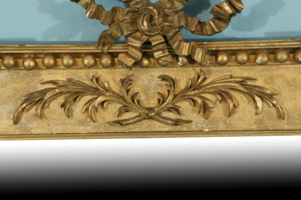A HIGHLY CARVED AND GILTWOOD MIRROR, CIRCA 1830 - 6