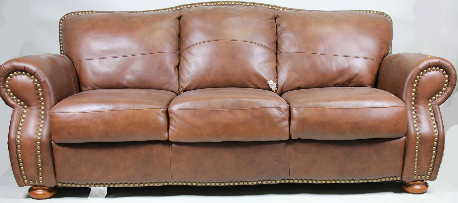 LEATHER SOFA: LEATHER SOFA. RIPPED BACK CUSHION, SOLD AS IS. Height: 36 in. by Width: 87 in. by Depth: 44