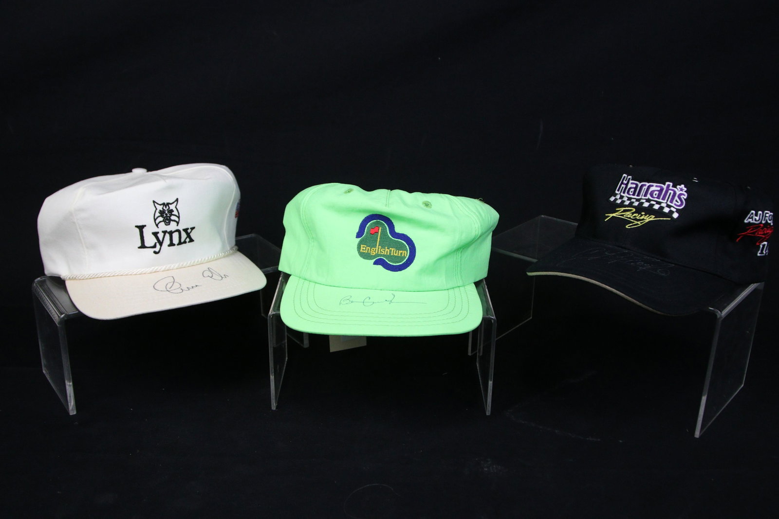 SET OF THREE AUTOGRAPHED GOLF HATS: SET OF THREE AUTOGRAPHED HATS - BEN CRENSHAW, AJ FOYT, & ERNIE ELS **FROM THE JOHN WALTON ESTATE**