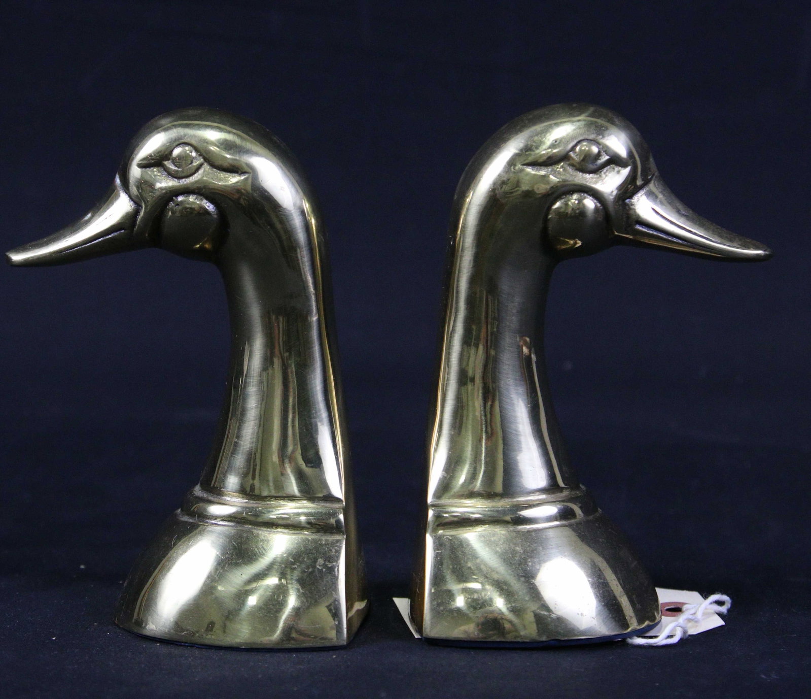 PAIR OF BRASS DUCK BOOKENDS: PAIR OF BRASS DUCK BOOKENDS - **FROM THE JOHN WALTON ESTATE** Height: 4 in. by Width: 4 in. by Depth: 4