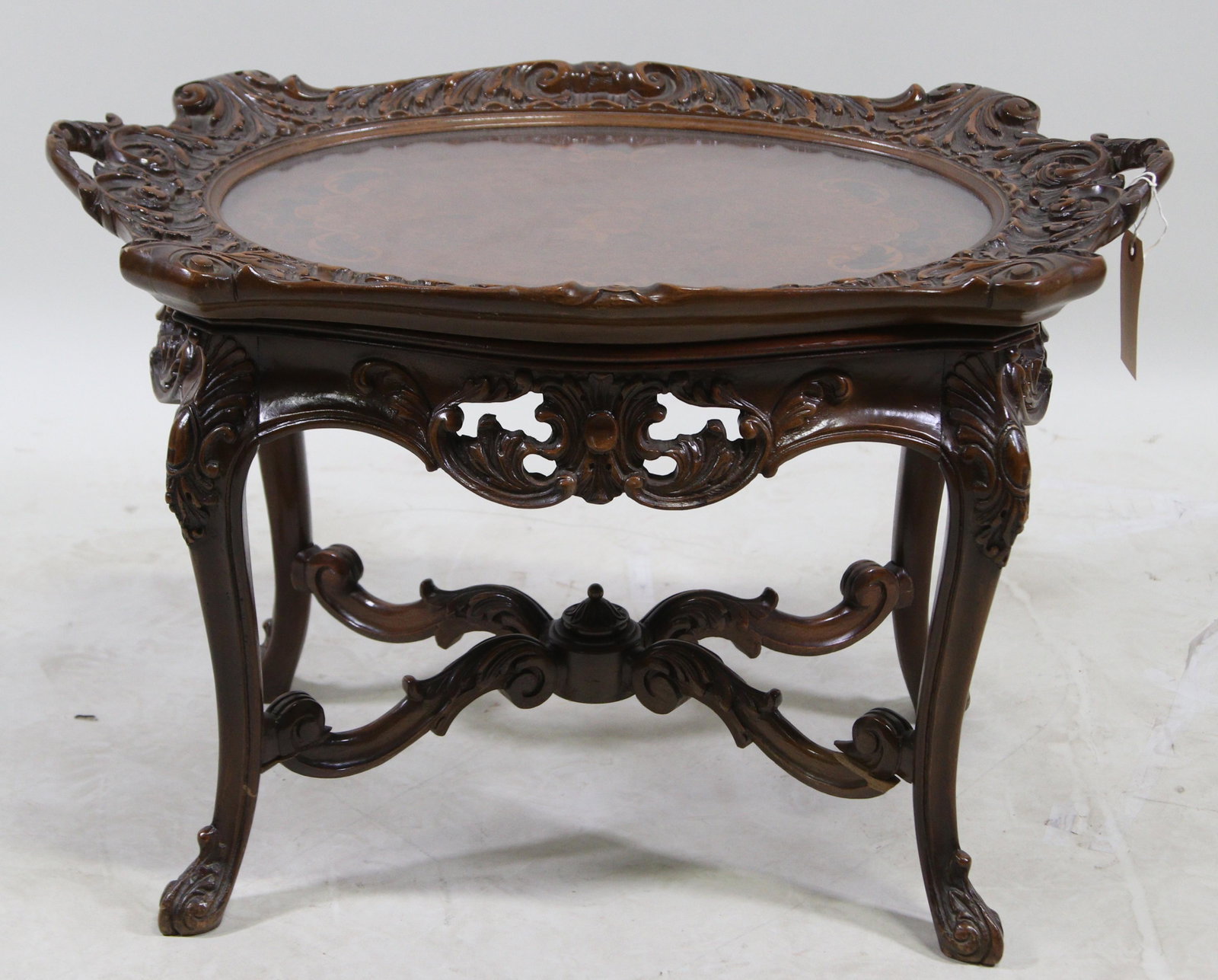 CIRCA 1920: CIRCA 1920's OVAL CARVED & INLAID TRAY TABLE WITH REMOVEABLE TOP. Height: 1.50 in. by Width: 29.50 in. by Depth: 16.50