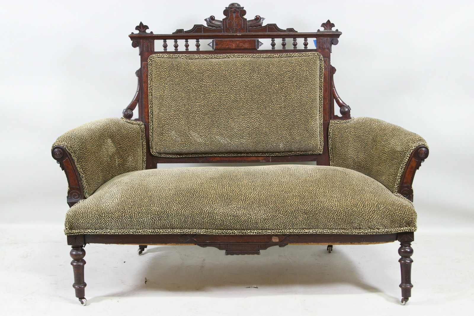VICTORIAN EASTLAKE SETTEE FAUX LEOPARD PRINT: VICTORIAN EASTLAKE SETTEE FAUX LEOPARD PRINT. NEEDS REGLUEING, LOOSE LEGS & BACK, SOLD AS IS. Height: 45 in. by Width: 59 in. by Depth: 21 IN.