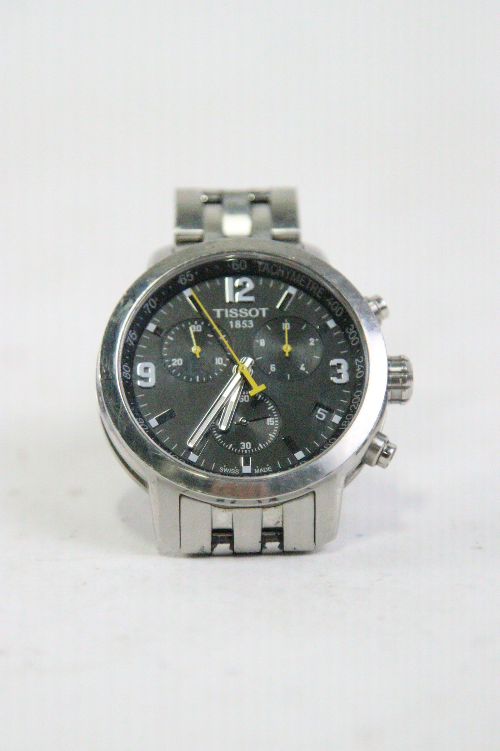 TISSOT 1853 CHRONOGRAPH GREY FACE WATCH (USED): TISSOT 1853 CHRONOGRAPH GREY FACE WATCH (USED) - SHOWS HEAVY USE, NEEDS RE-POLISHING **FROM THE JOHN WALTON ESTATE**