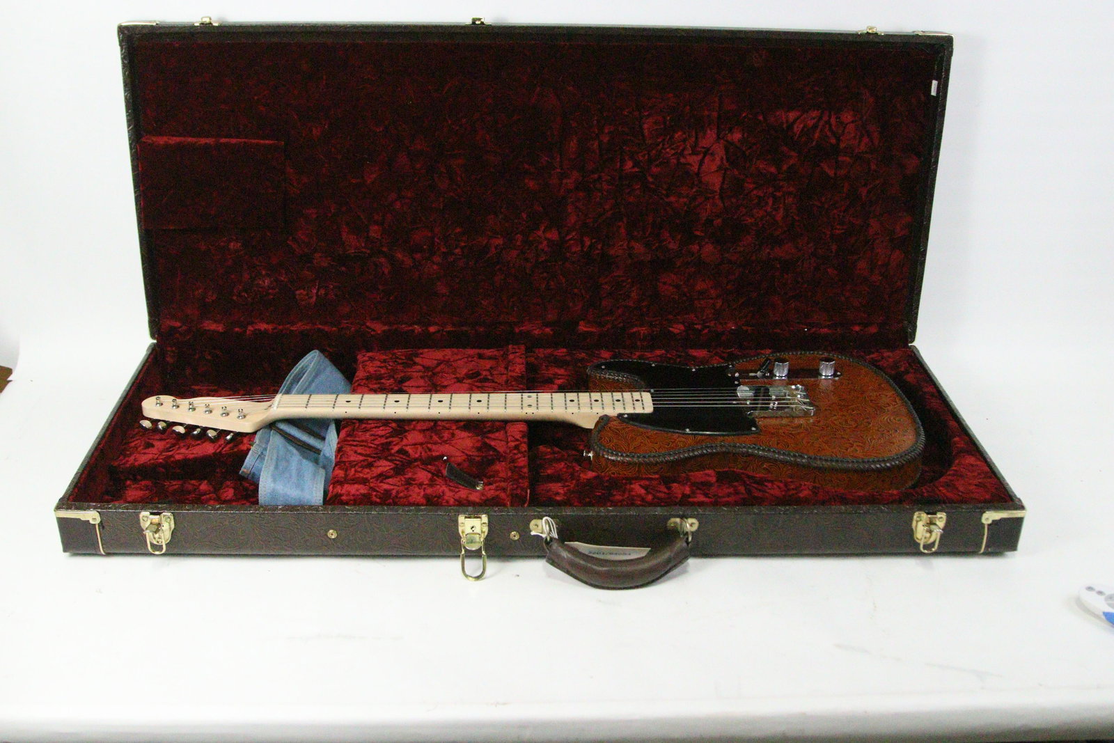 CUSTOM TOOLED LEATHER ELECTRIC GUITAR W/MATCHING C: CUSTOM TOOLED LEATHER ELECTRIC GUITAR W/MATCHING CASE - BLACK LEATHER PLATE ON FRONT; CUSTOM FENDER ELECTRONICS & PARTS **FROM THE JOHN WALTON ESTATE**