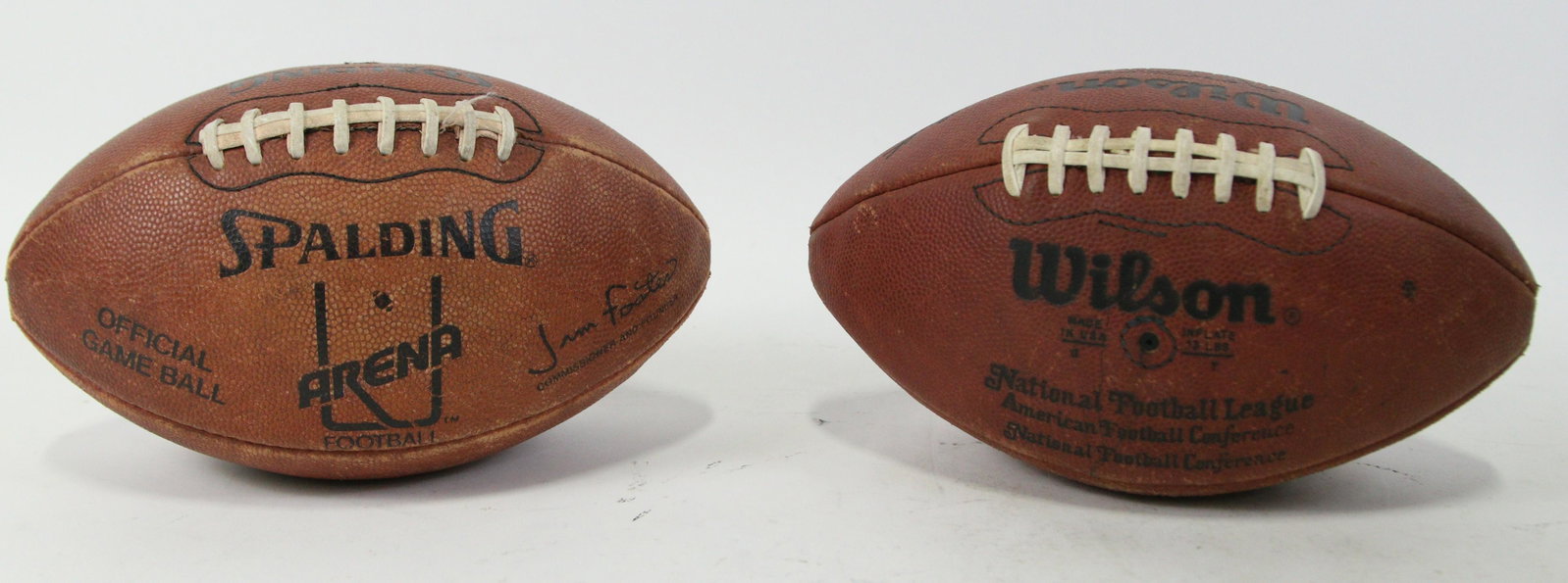 BOX LOT OF TWO FOOTBALLS: BOX LOT OF TWO FOOTBALLS - SPALDING ARENA FOOTBALL GAME BALL FROM 1ST ARENA FB GAME IN NEW ORLEANS & NFL WILSON FOOTBALL