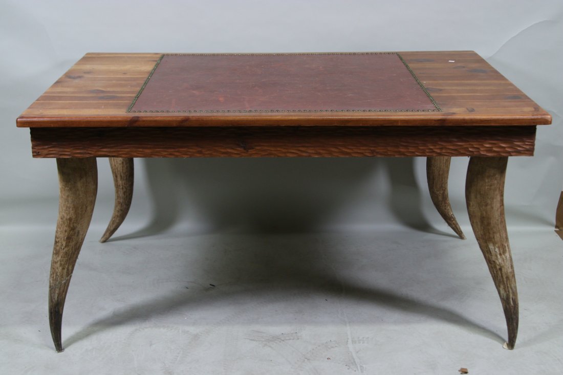 VINTAGE LEATHER TOP DESK WITH LONGHORN LEGS: JOHN WALTON'S PERSONAL VINTAGE LEATHER TOP OFFICE DESK WITH LONGHORN LEGSHeight: 31 in. by Width: 60 in. by Depth: 39.5**FROM THE JOHN WALTON ESTATE**