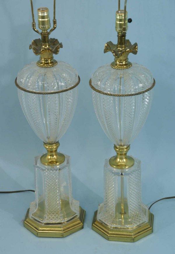 A PAIR OF PRESSED GLASS AND BRASS LAMPS