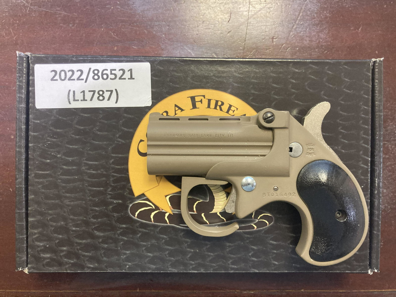 COBRA BIG BORE DERRINGER .22WMR PISTOL (NEW): COBRA BIG BORE DERRINGER .22WMR PISTOL (NEW) - TAN FINISH W/BLACK GRIPS, 2.75in BARREL, & 4.65in OALCALIBER: .22WMRSERIAL# BT017437NEW FIREARM(L1788) in. by Depth: 1