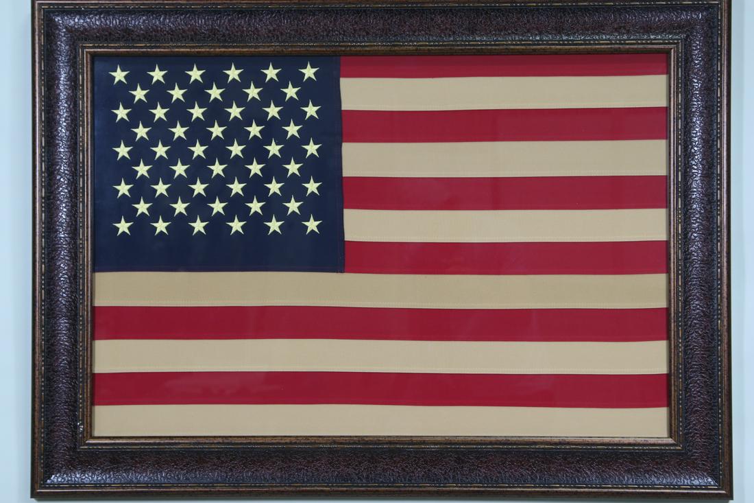 FRAMED AMERICAN FLAG: FRAMED AMERICAN FLAG Height: 31 in. by Width: 42 in. by Depth: 1
