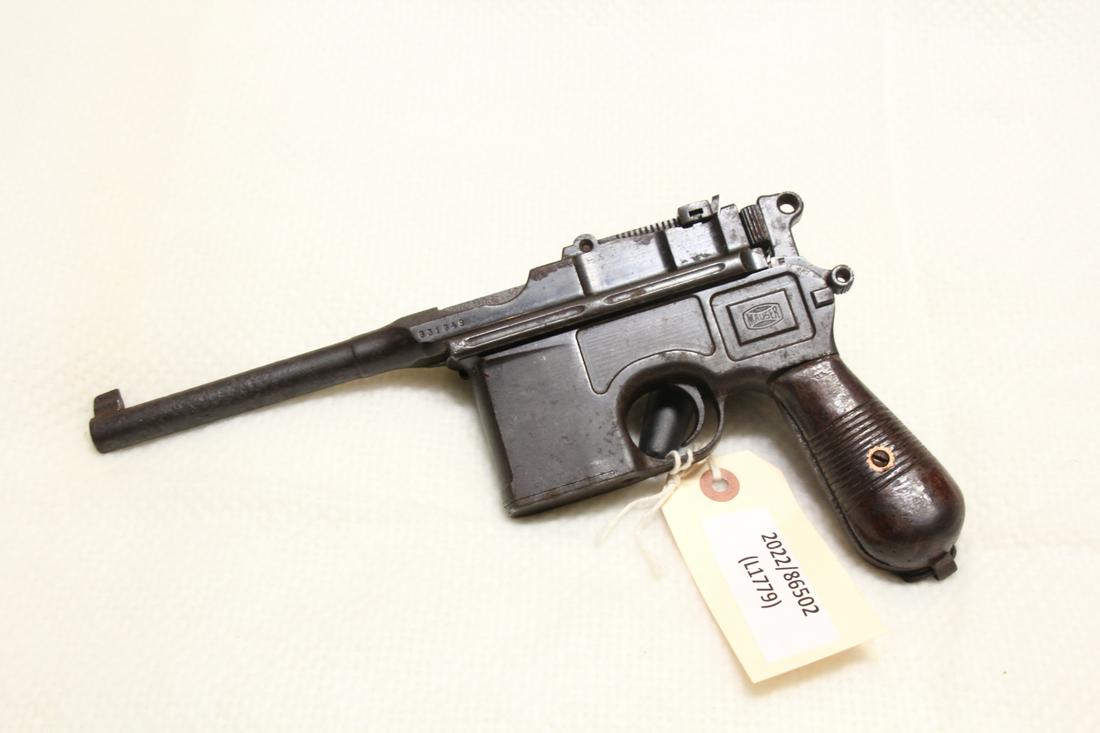 1930 MAUSER COMMERCIAL BROOMHANDLE C96 PISTOL: 1930 MAUSER COMMERCIAL BROOMHANDLE C96 PISTOL - 5.2in STEPPED BARREL W/AVERAGE BORE, 12 GROOVE WELL USED GRIPS, ADJUSTABLE 50-1,000 METER REAR SIGHT, SOME RUST & PITTING ON FRAME, INCLUDES LEATHER HOL