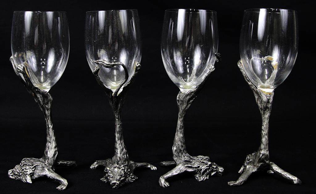 SET OF FOUR LION BASE WINE GOBLETS: SET OF FOUR LION BASE WINE GOBLETS. Height: 9 in. by Width: 4 in. by Depth: 4