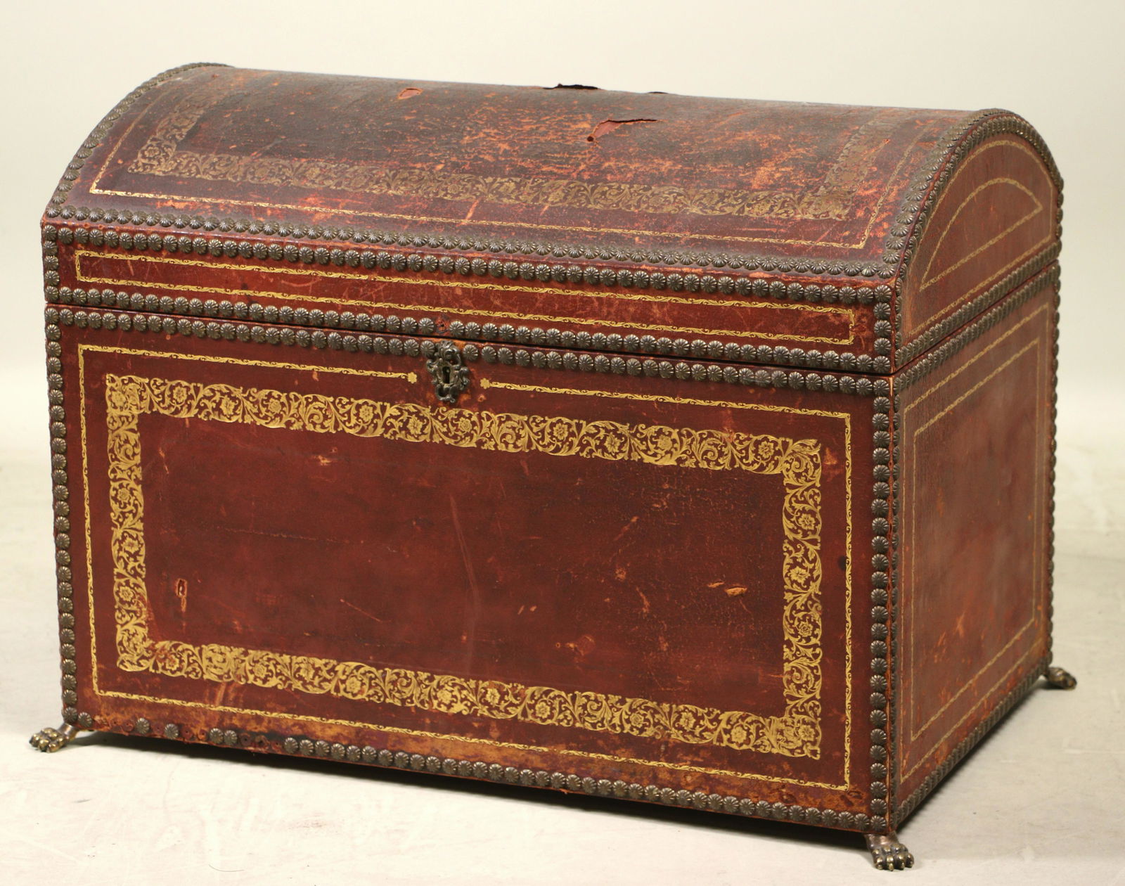 ANTIQUE HUMPBACK TOOLED & GILDED LEATHER TRUNK (1 of 4)