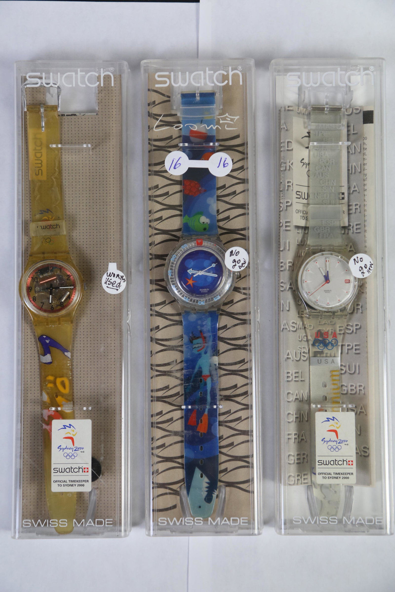SET OF 3 SWatch WatchES â€“ LTD ED 2000 SYDNEY GAMES: SET OF 3 SWATCH WATCHES FROM THE 2000 SYDNEY GAMES IN THEIR ORIGINAL PLASTIC CASES.