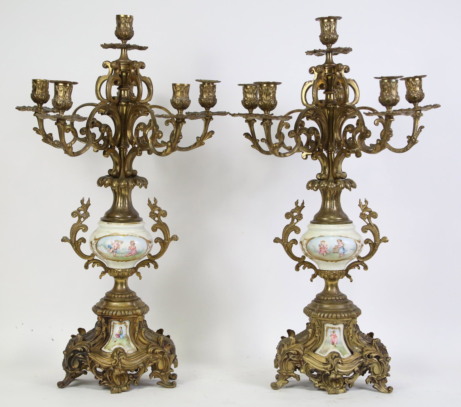 PAIR OF C.19 FRENCH BRONZE & LIMOGES CANDELABRA: PAIR OF C. 1900 FRENCH GILT BRONZE ON LIMOGES URN CANDELABRA. Height: 26 in. by Width: 14 in. by Depth: 14