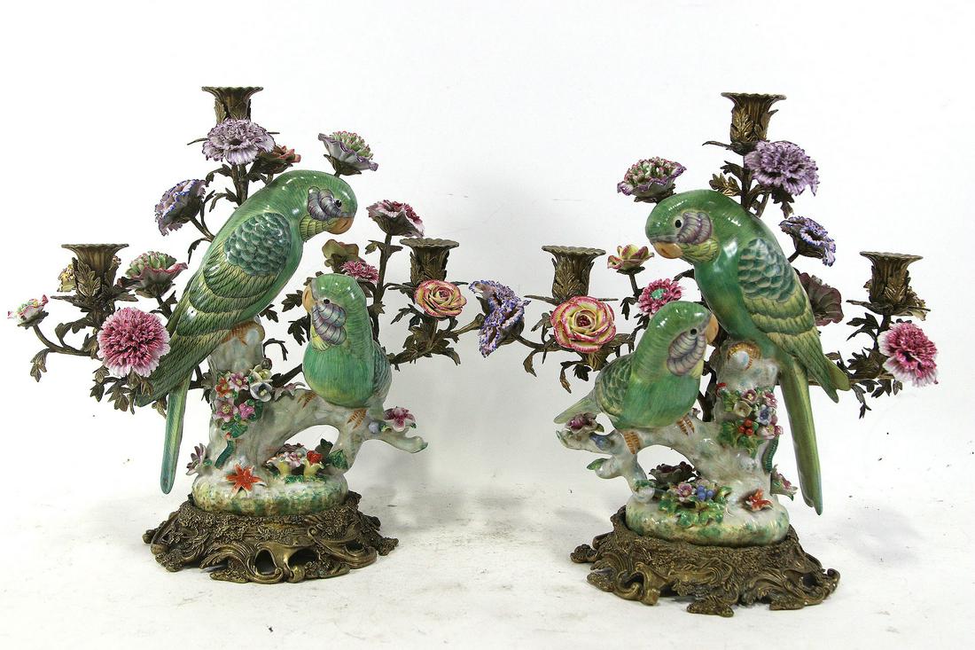 PAIR OF PORCELAIN PARROT & FLOWERS CANDELABRA: PAIR OF PORCELAIN PARROT & FLOWERS ON BRASS BASE CANDELABRA. ONE HAS MINOR RESTORATION. Height: 15.5 in. by Width: 18 in. by Depth: 9.5