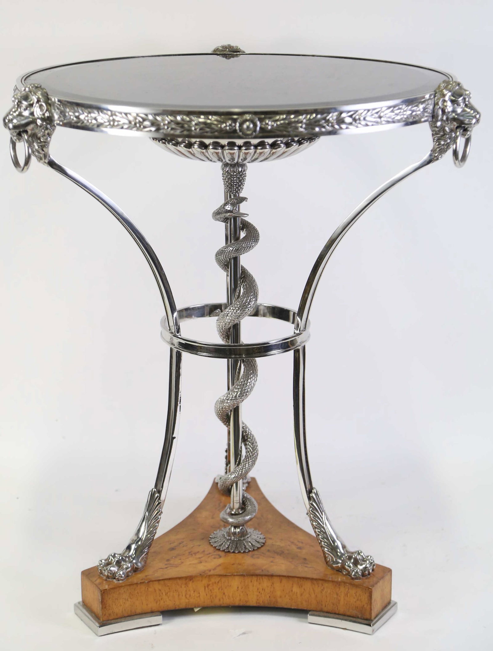GUERIDON TABLE: GUERIDON TABLE WITH NICKEL SILVER LION HEADS AND CENTER COILED SNAKE ON BASE ON LION PAW FEET AND BLUE MIRRORED TOP. Height: 27.5 in. by Width: 24 in. by Depth: 24