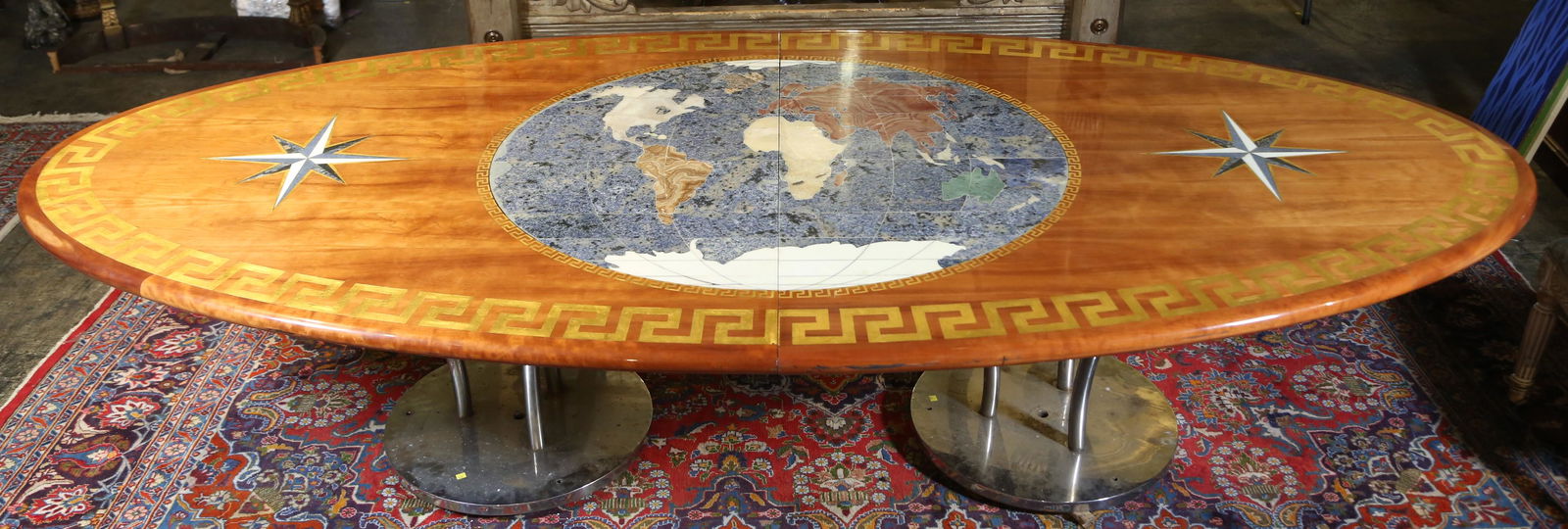 CUSTOM MADE LARGE YACHT DINING TABLE: CUSTOM MADE LARGE YACHT DINING TABLE WITH DUAL CHROME BASE. HAS INLAID BRASS, LAPIS AND MALACHITE IN THE SHAPE OF A WORLD MAP WITH GREEK KEY EDGE. 29\\\"h x 122\\\"w x 56\\\"d.