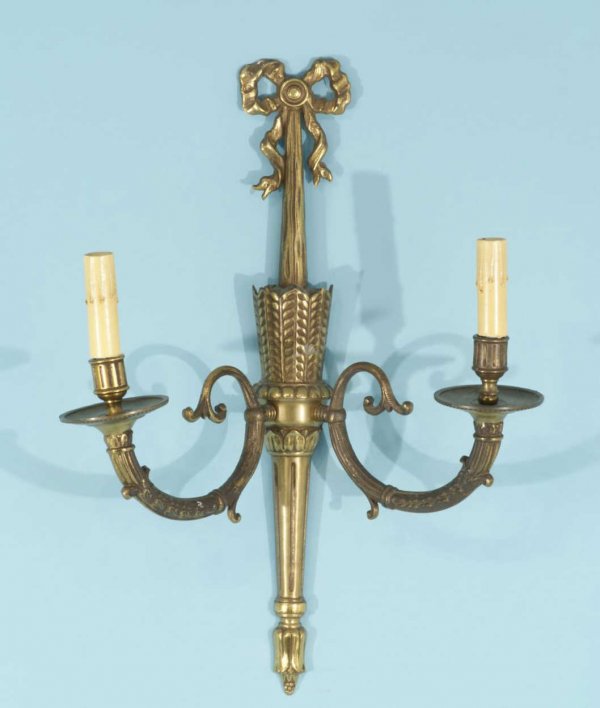 A TWO-LIGHT GILT BRONZE WALL SCONCE