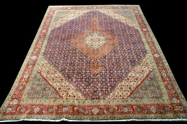 SEMI-ANTIQUE TABRIZ FISH DESIGN RUG FROM IRAN: SEMI-ANTIQUE TABRIZ FISH DESIGN RUG. BURGUNDY, RUST, CAMEL IN A PLUM BACKROUND. ORIGIN: PERSIA/IRAN Height: 12 ft. 7 1/2 in. by Width: 10 ft. 2 1/2 in.