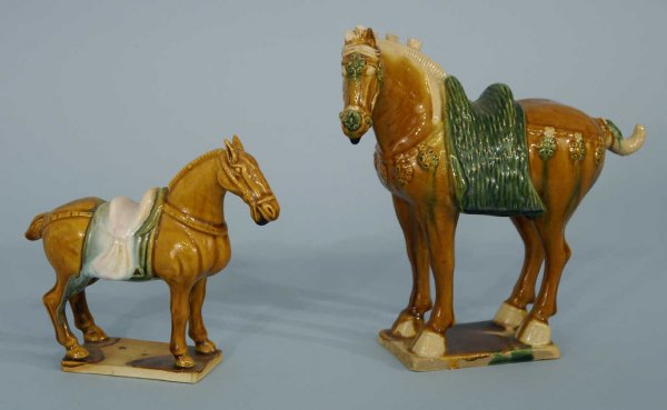 TWO BROWN AND GREEN MAJOLICA HORSE STATUETTES