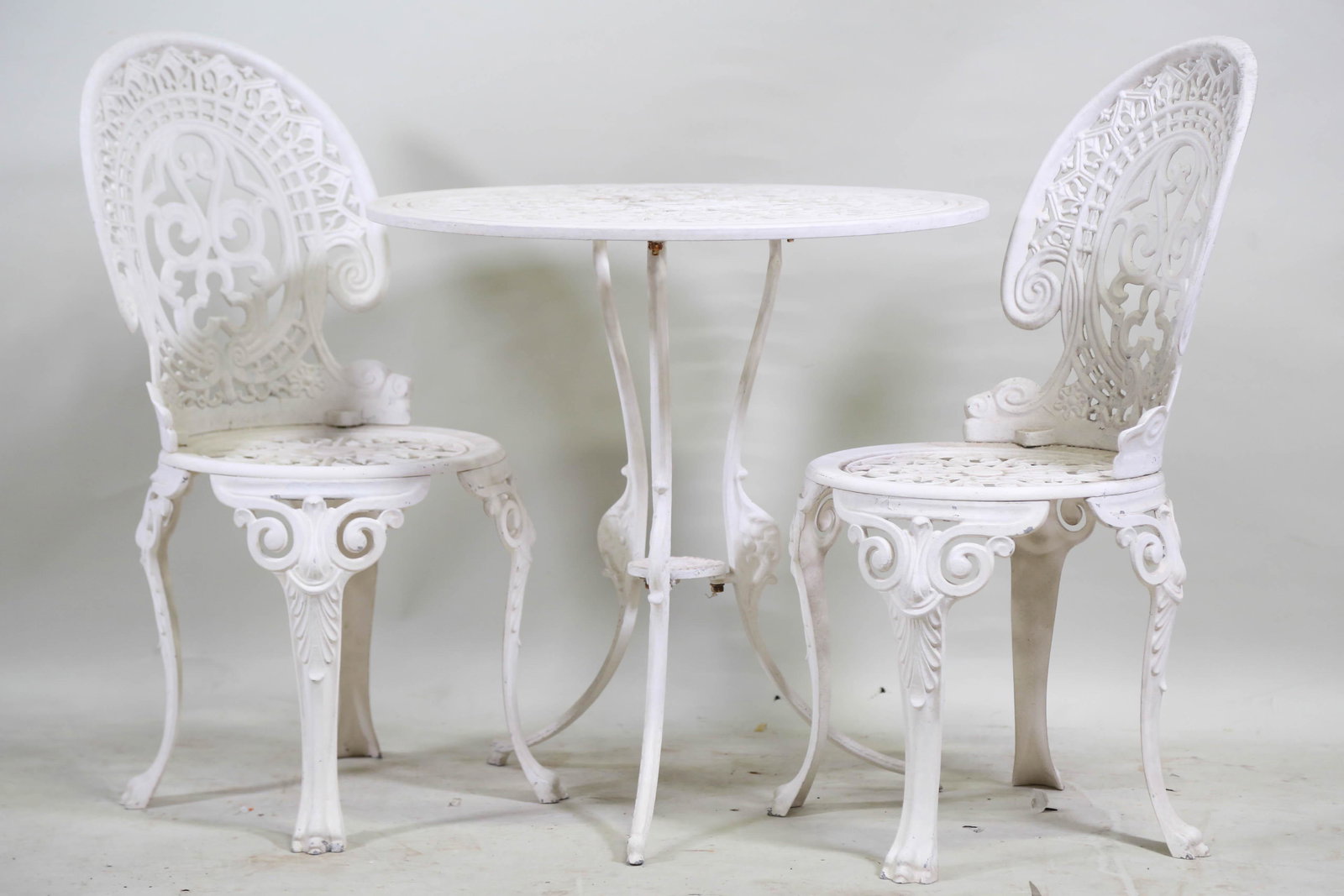 CAST ALUMINUM PATIO TABLE AND TWO CHAIRS: CAST ALUMINUM PATIO TABLE AND TWO CHAIRS. Height: 26.75 by Width: 27 by Depth: 27