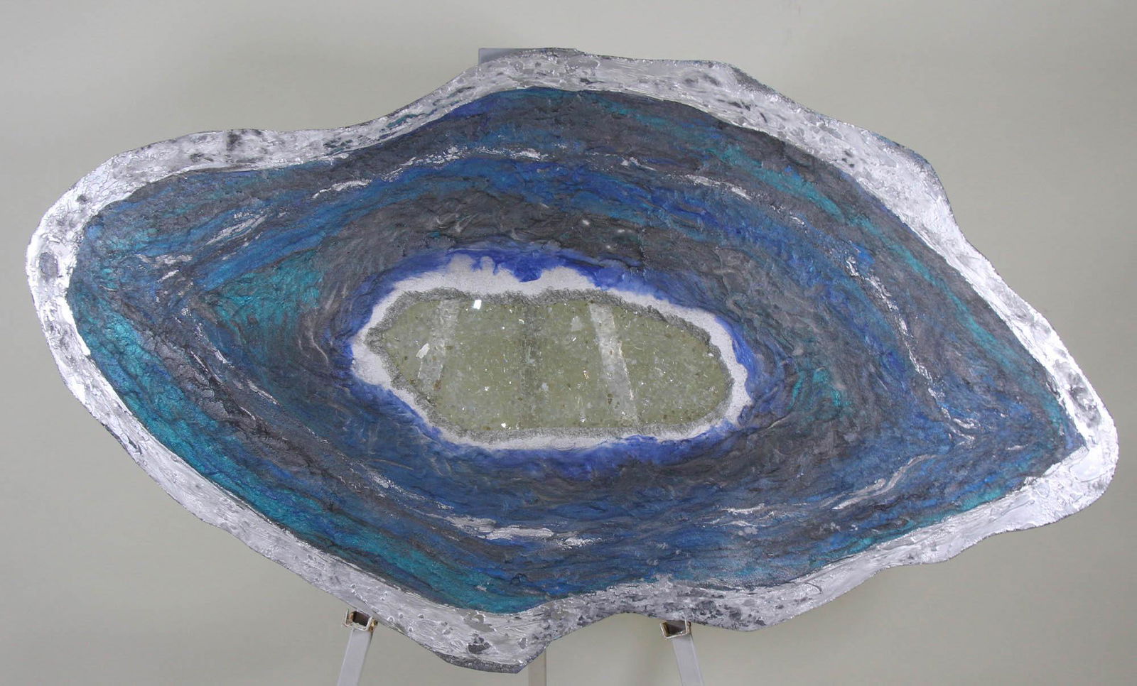 WILLIAM LLOYD FAUX GEO PAINTED ON WOOD: WILLIAM LLOYD FAUX GEO PAINTED ON WOOD WITH GLASS CHARDS THAT LOOK LIKE CRYSTAL. JUNE/JULY 2019. Height: 34 by Width: 61 by Depth: 1