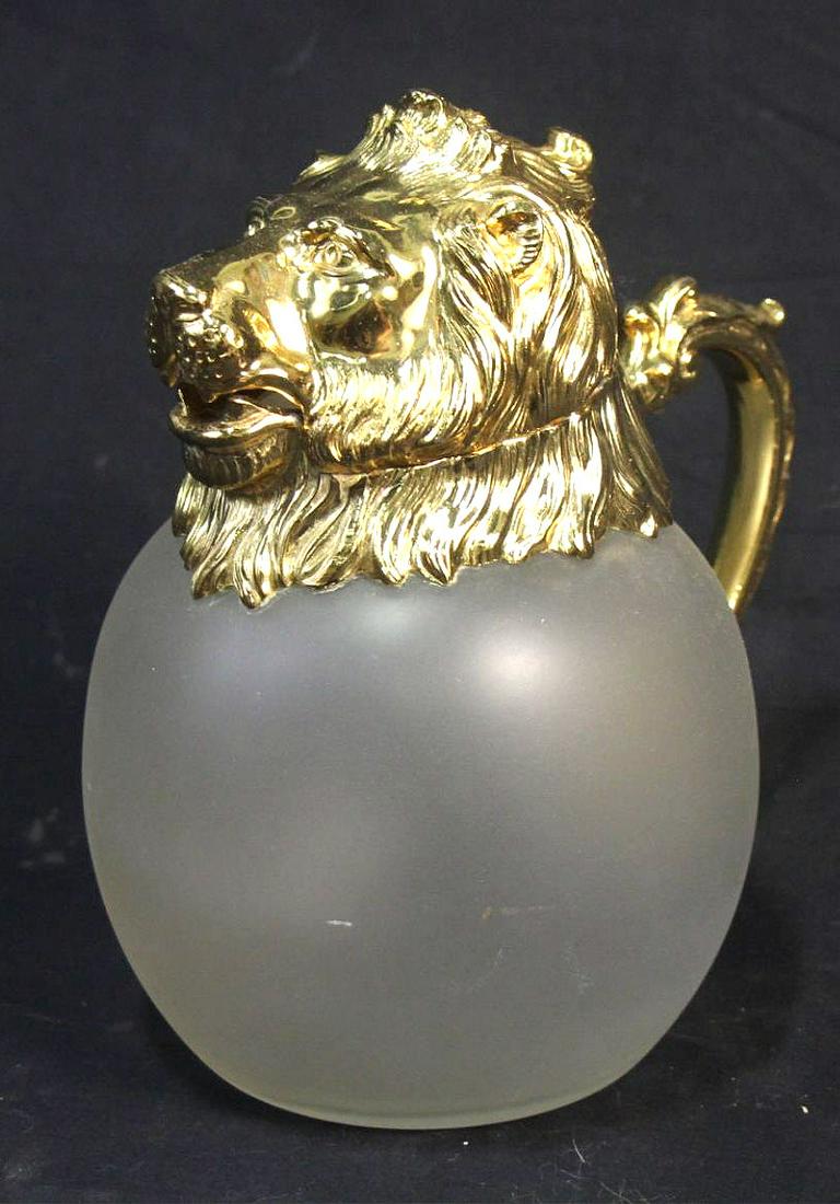 GLASS JAR HINGED WITH LION HEAD IN BRASS: GLASS JAR HINGED WITH LION HEAD IN BRASS Height: 8 in. by Width: 5 in. by Depth: 7