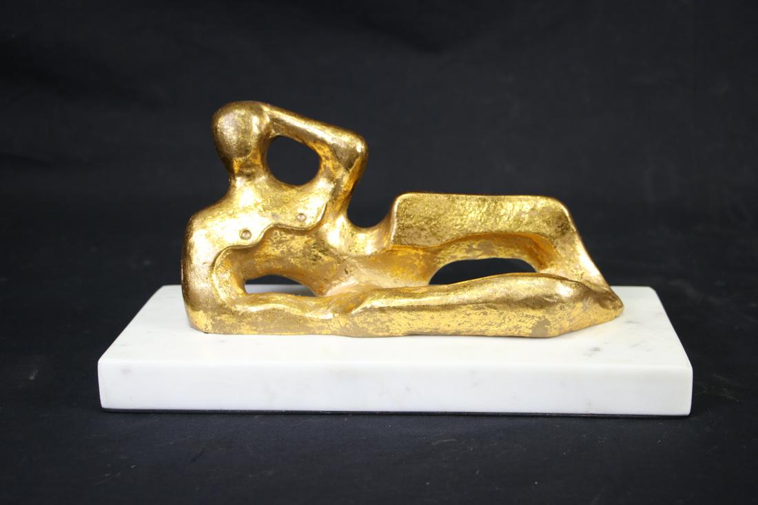 RECLINING GILT BRONZE SCULPTURE ON MARBLE PLINTH: RECLINING GILT BRONZE SCULPTURE ON MARBLE PLINTH. Height: 6.5 in. by Width: 12 in. by Depth: 5
