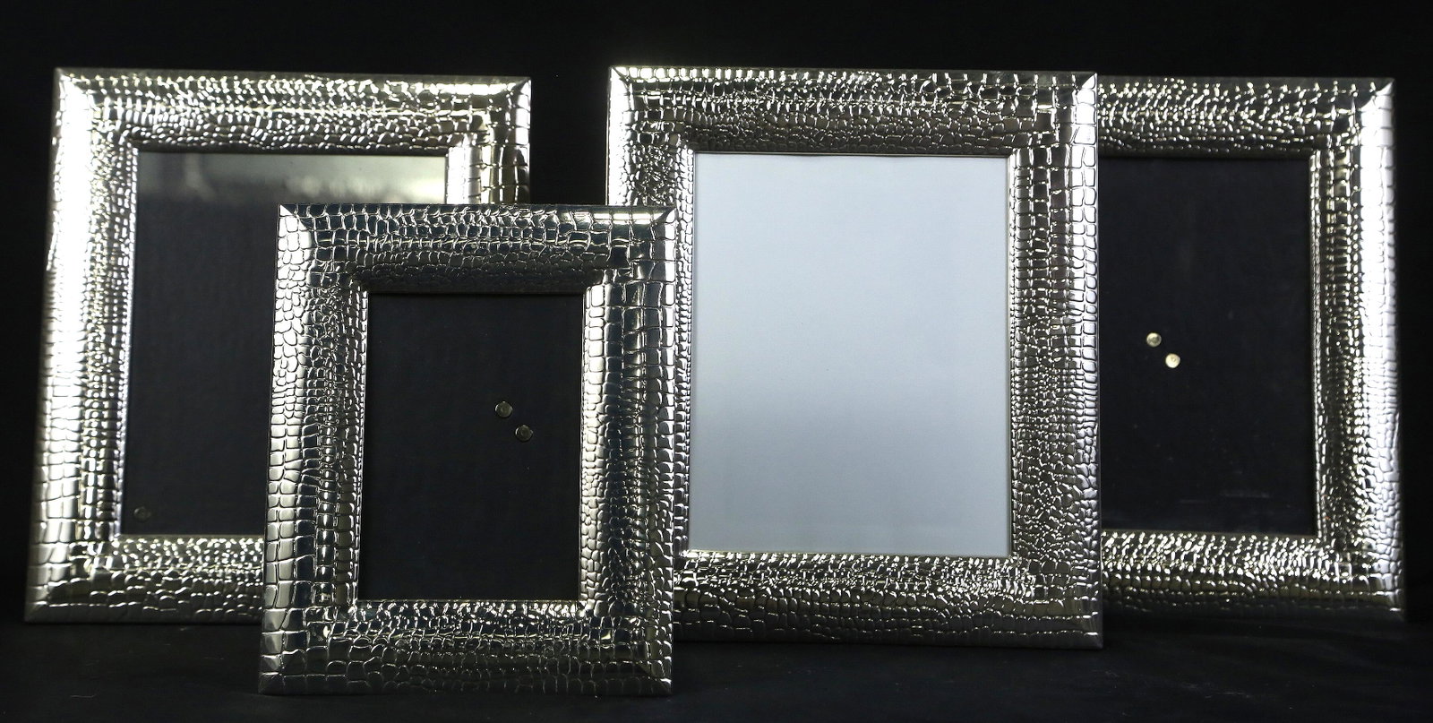 SET OF 4 STERLING SILVER PICTURE FRAMES: SET OF 4 STERLING SILVER PICTURE FRAMES. Height: 13.5 in. by Width: 11.5