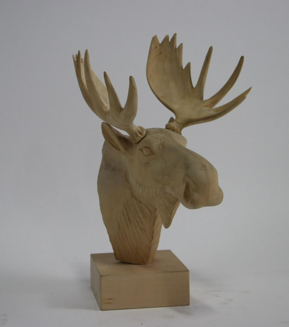 WOODEN MOOSE HEAD WITH WOODEN BASE: WOODEN MOOSE HEAD WITH WOODEN BASE Height: 15 in. by Width: 11 in. by Depth: 7