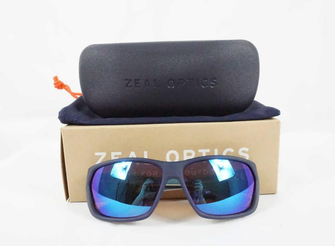 PAIR OF ZAEL OPTICS SUNGLASSES: NEW PAIR OF ZAEL OPTICS SUNGLASSES - FRAME FEATURES: RUBBER NOSEPAD, RUBBER TEMPLES; FRAME MATERIALS: PLASTIC; TEMPLES: BENT
