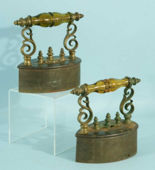 PAIR OF ANTIQUE IRONS: PAIR OF ANTIQUE IRONS. Height: 7 in. by Width: 7 in. by Depth: 4 in.