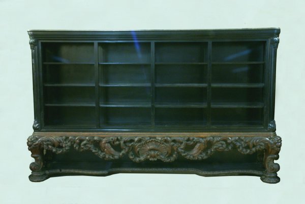 ORNATELY CARVED GERMAN BAROQUE CABINET, CIRCA 1850: ORNATELY WOOD CARVED GERMAN BAROQUE DISPLAY CABINET. CIRCA 1850. Height: 74 1/2 in. by Width: 126 in. by Depth: 21 1/2 in.