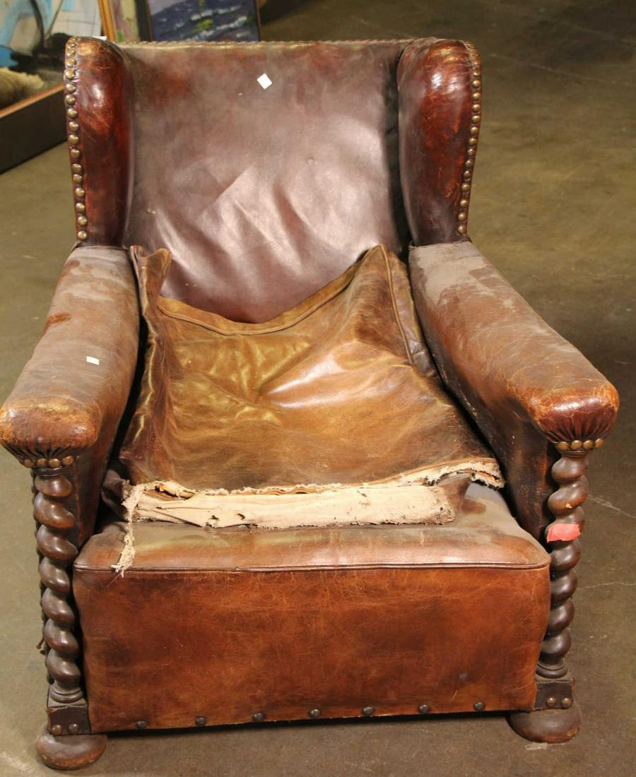 VINTAGE BROWN LEATHER WINGBACK CHAIR: VINTAGE BROWN LEATHER WING CHAIR. WORN, SOLD IN AS IS CONDITION. Height: 30 by Width: 29.5 by Depth: 35