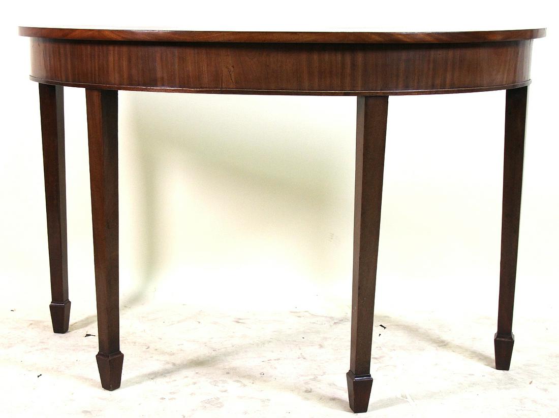 VINTAGE MAHOGANY DEMILUNE TABLE ON SPADE FEET: VINTAGE MAHOGANY DEMILUNE TABLE ON SPADE FEET. Height: 31 in. by Width: 48 in. by Depth: 19 in.