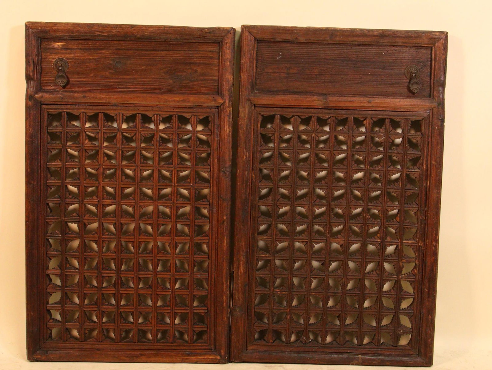 PAIR OF ANTIQUE SPANISH CARVED WINDOW GRILL PANELS: PAIR OF ANTIQUE SPANISH CARVED WINDOW GRILL PANELS. Height: 36 in. by Width: 22 in. by Depth: 2 in.