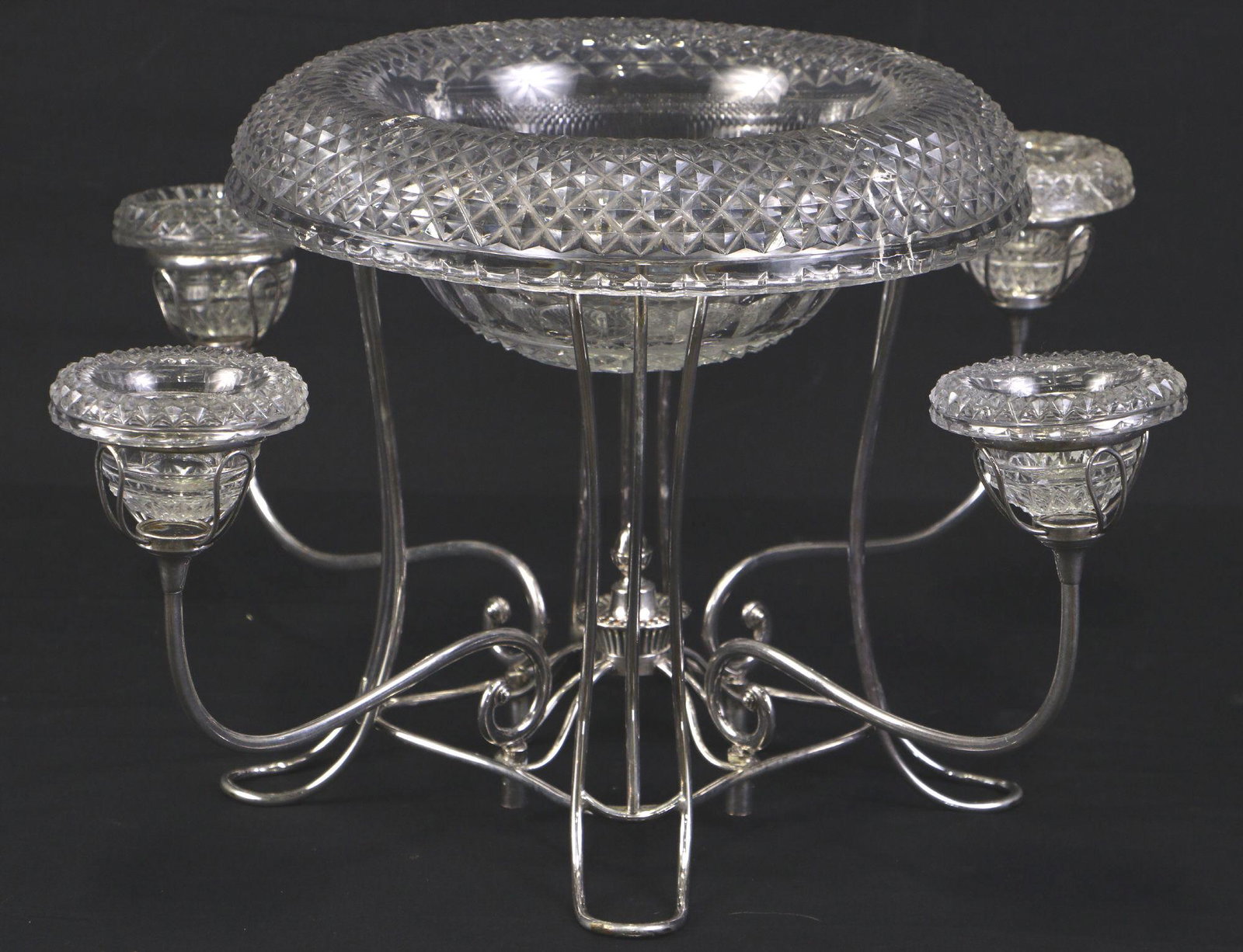 CUT GLASS & SILVER PLATED EPERGNE: CUT GLASS & SILVER PLATED EPERGNE. DAMAGE ON ONE SMALL CUP, SOLD AS IS. Height: 10 in. by Width: 21 in. by Depth: 21 in.