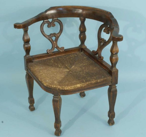 ANTIQUE ENGLISH CORNER CHAIR, CIRCA 1850's: ANTIQUE ENGLISH MAHOGANY CORNER CHAIR WITH RUSH SEAT. CIRCA 1850's. Height: 29 in. by Width: 28 in. by Depth: 23 in.