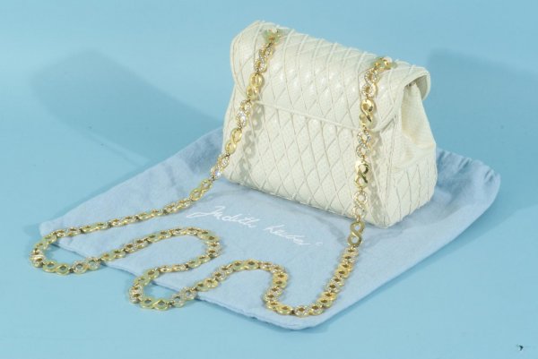 JUDITH LEIBER SNAKESKIN HANDBAG IN IVORY: JUDITH LEIBER SNAKESKIN HANDBAG IN IVORY WITH RHINESTONE AND GOLD TONE CHAIN HANDLE. INCLUDES DUSTCOVER AND MIRROR AND GOLD TONE COMB INSIDE THE HANDBAG. Height: 5 1/4 in. by Width: 6 1/2 in. by Depth