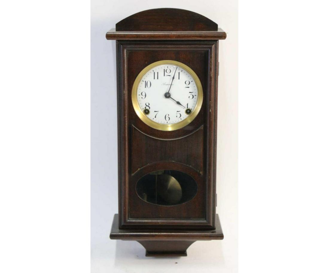 CIRCA 1920' s ANSONIA WALL CLOCK: CIRCA 1920' s ANSONIA WALL CLOCK. Height: 18 in. by Width: 7.5 in. by Depth: 4 in.