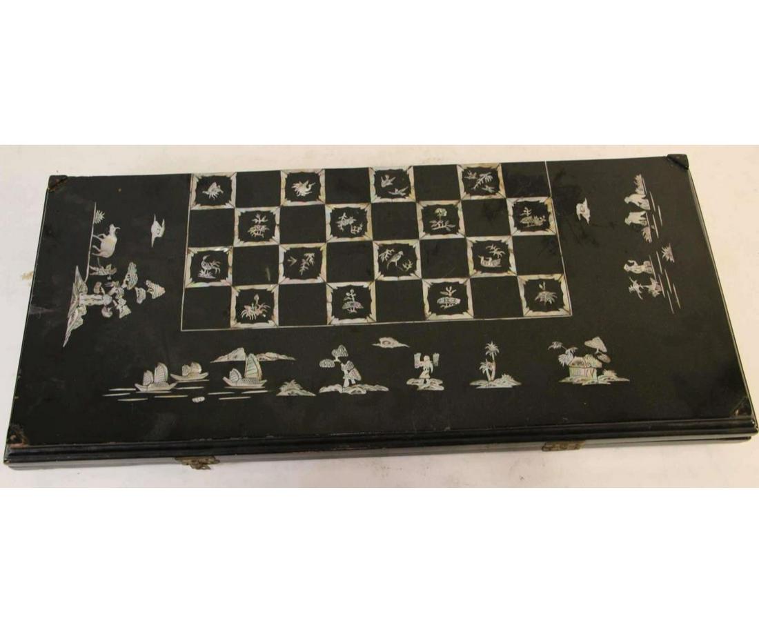 BLACK LACQUERED & MOTHER-OF-PEARL CHESSBOARD: BLACK LACQUERED & MOTHER-OF-PEARL INLAID CHESSBOARD. Height: 3 in. by Width: 25 in. by Depth: FC