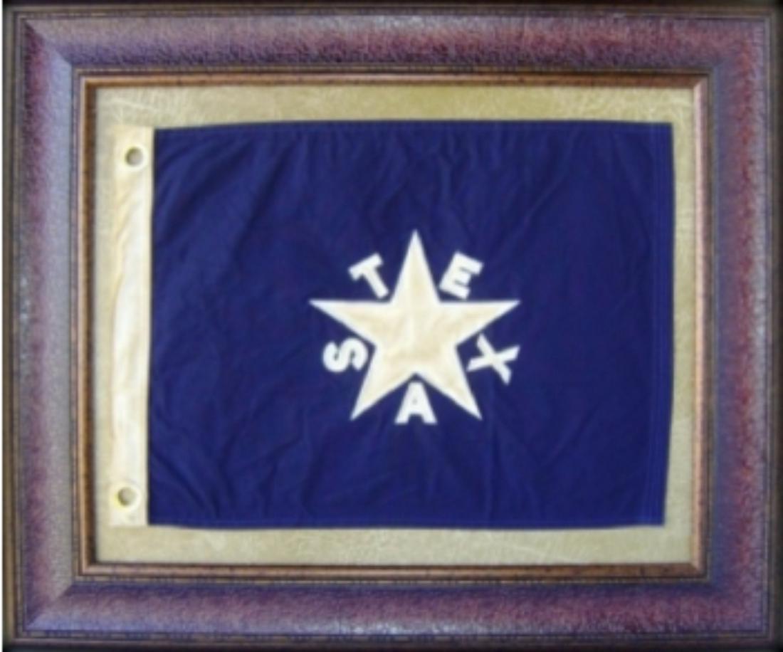 FRAMED DE ZAVALA TEXAS FLAG: FRAMED DE ZAVALA TEXAS FLAG. Height: 27 in. by Width: 31 in.