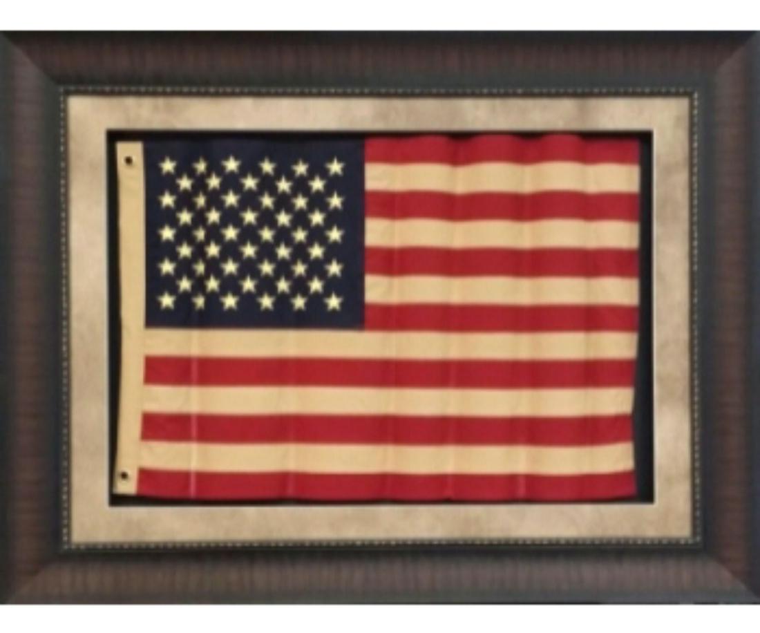 FRAMED WAVY US FLAG: FRAMED WAVY US FLAG. Height: 39 in. by Width: 49 in.