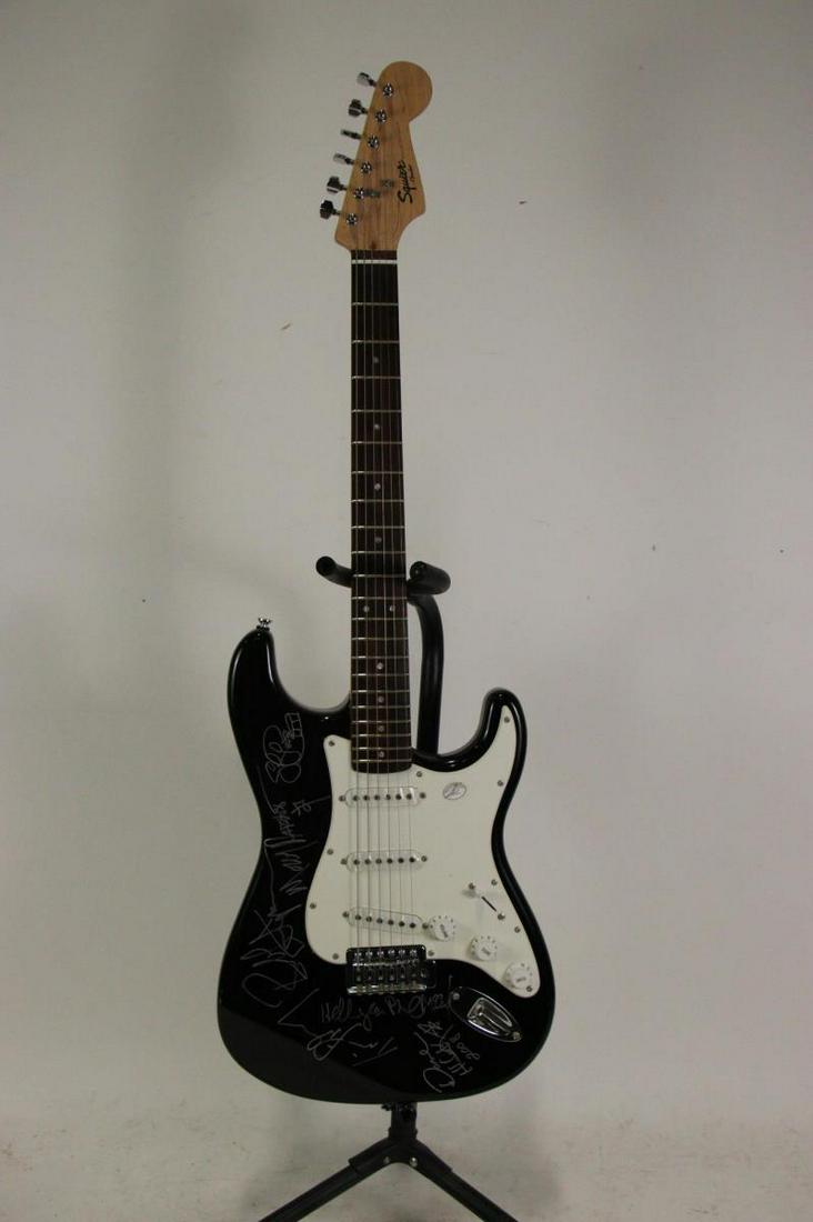 SQUIER FENDER ELECTRIC GUITAR SIGNED MOLLY HATCHET: SQUIER FENDER ELECTRIC GUITAR SIGNED MOLLY HATCHET Height: 39 in. by Width: 13 in. by Depth: 1.5 in.
