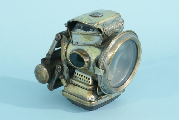 JOS. LUCAS ACETYLENE MOTORCYLE LIGHT, CIRCA 19th: ANTIQUE ACETYLENE MOTORCYCLE LIGHT, TYPE "NEW HOLOPHOTE" MADE BY JOSEPH LUCAS LTD. SILVER KING, BIRMINGHAM. CIRCA 1900. Height: 5 in. by Width: 5 1/2 in. by Depth: 3 1/2 in.