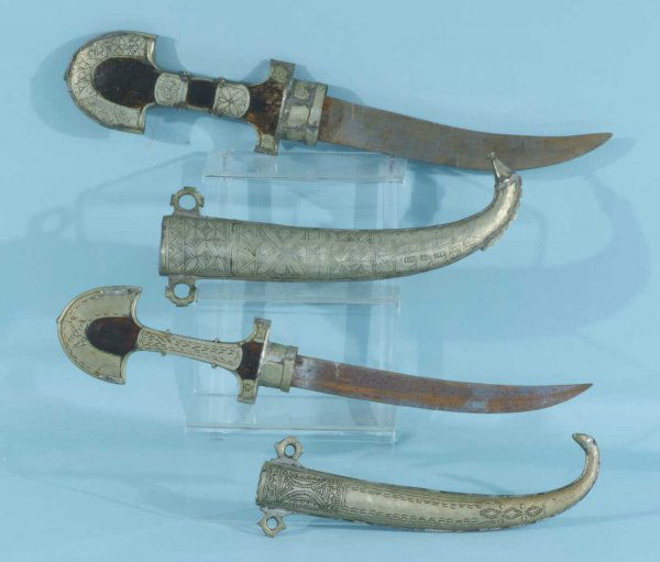 TWO VINTAGE MIDDLE EASTERN DAGGERS WITH SHEATHS: TWO VINTAGE MIDDLE EASTERN DAGGERS WITH SHEATHS. Height: 3 and 2 1/2 in. by Width: 16 and 18 in. by Depth: 1 1/4 and 3/4 in.