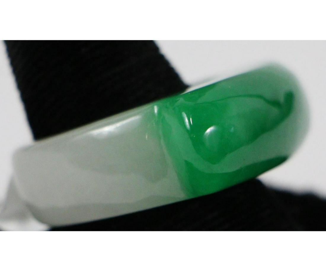 CHINESE GREEN JADE ARROW HOLDER RING: A dark green Jade stone, Chinese arrow holder. In NEW condition.
