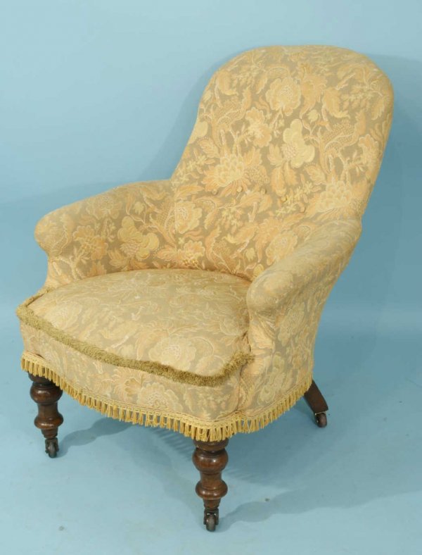ANTIQUE VICTORIAN SLIPPER CHAIR, CIRCA 1850: ANTQIUE VICTORIAN GOLD SLIPPER CHAIR ON CASTERS. CIRCA 1850. Height: 33 in. by Width: 27 in. by Depth: 32 in.