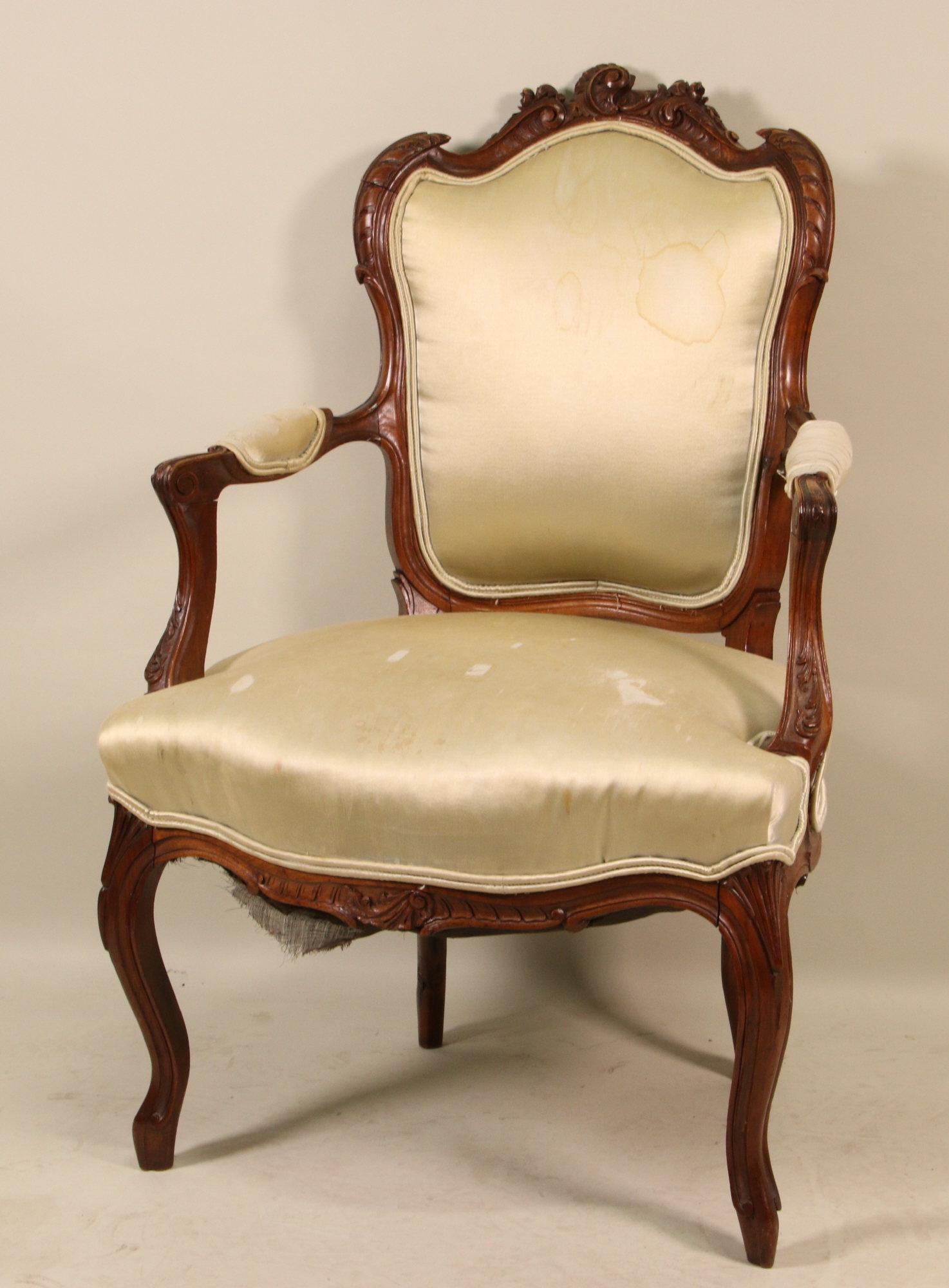 ANTIQUE FRENCH ARMCHAIR: ANTIQUE FRENCH ARMCHAIR WITH SILK SEAT. STAINS AND TEARS. SOLD AS IS. Height: 37 in. by Width: 26 in. by Depth: 25 in.